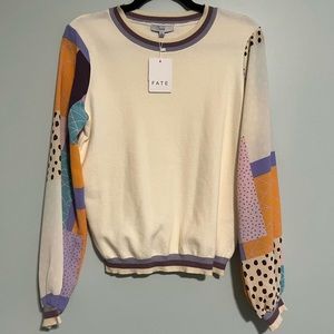 Fate, small, cream bodied sweater with abstract multi-colored sleeves. NWT